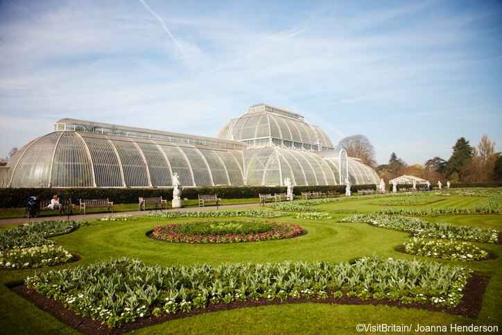 The Royal Botanic Gardens, Kew, usually referred to as Kew Gardens. A national landmark and visitor attraction in West London. The historic Decimum Burton designed glasshouse, the Palm House, with a huge dome, built in the 19th century.