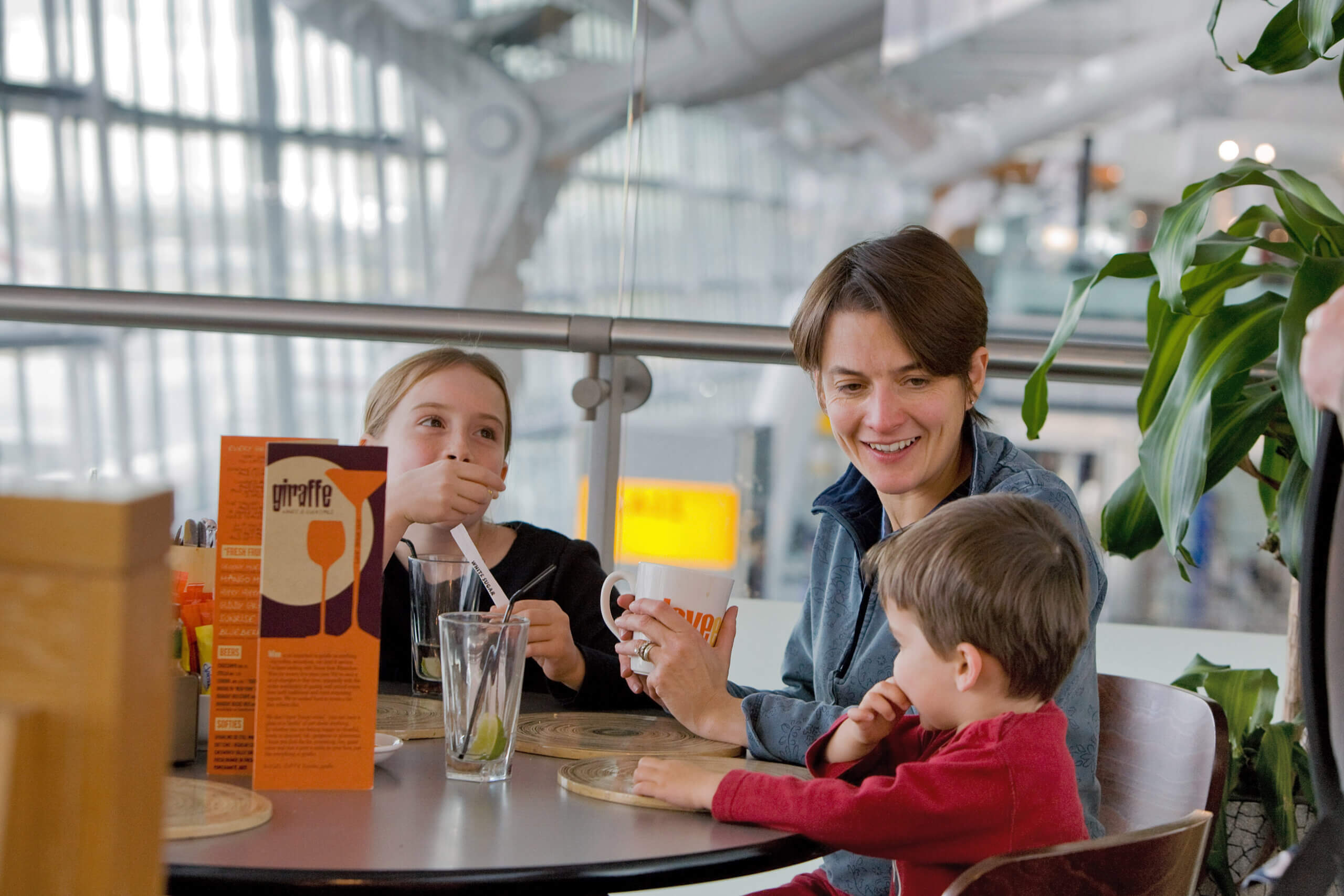 Heathrow Airport, Terminal 5A, airside, family in Giraffe restaurant. Copyright BAA Airports LimitedStrictly for BAA related articles only - strictly not for use in generic airport / aviation articles. Source: www.baa.com/medialibrary