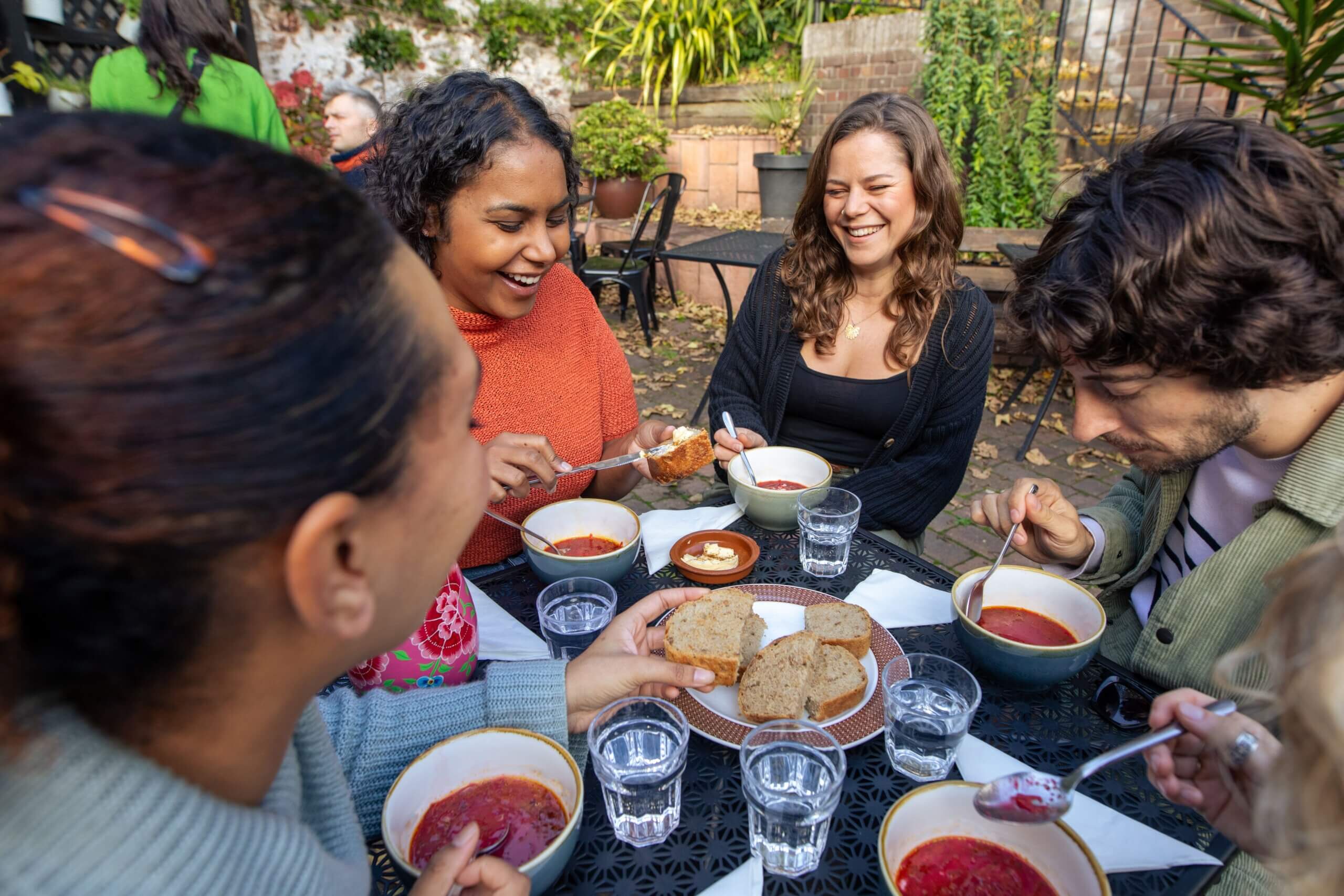 Friends enjoying Borscht soup at a local cafe in Bristol