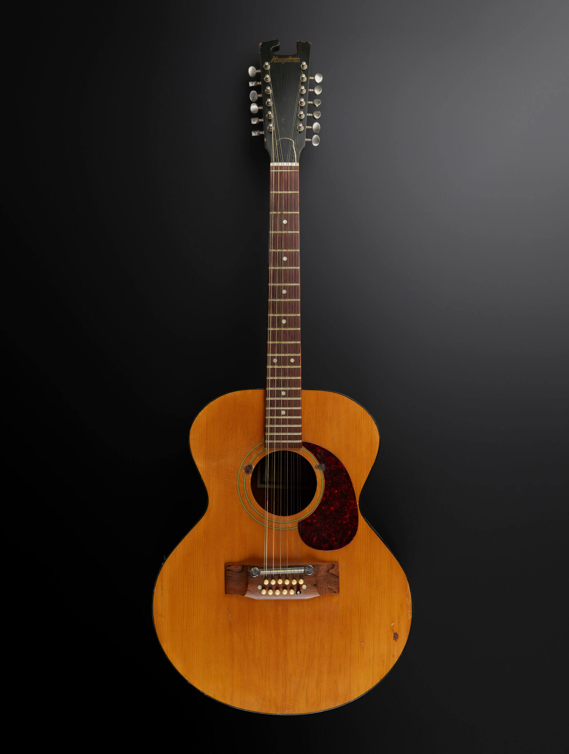 Harptone 12-string acoustic guitar and case used by David Bowie, ca. 1970. Image courtesy of the V&A.