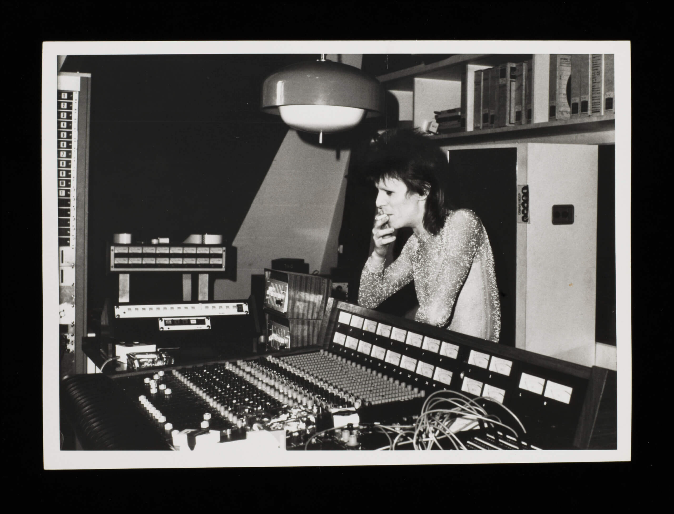 Photograph of David Bowie in a recording studio