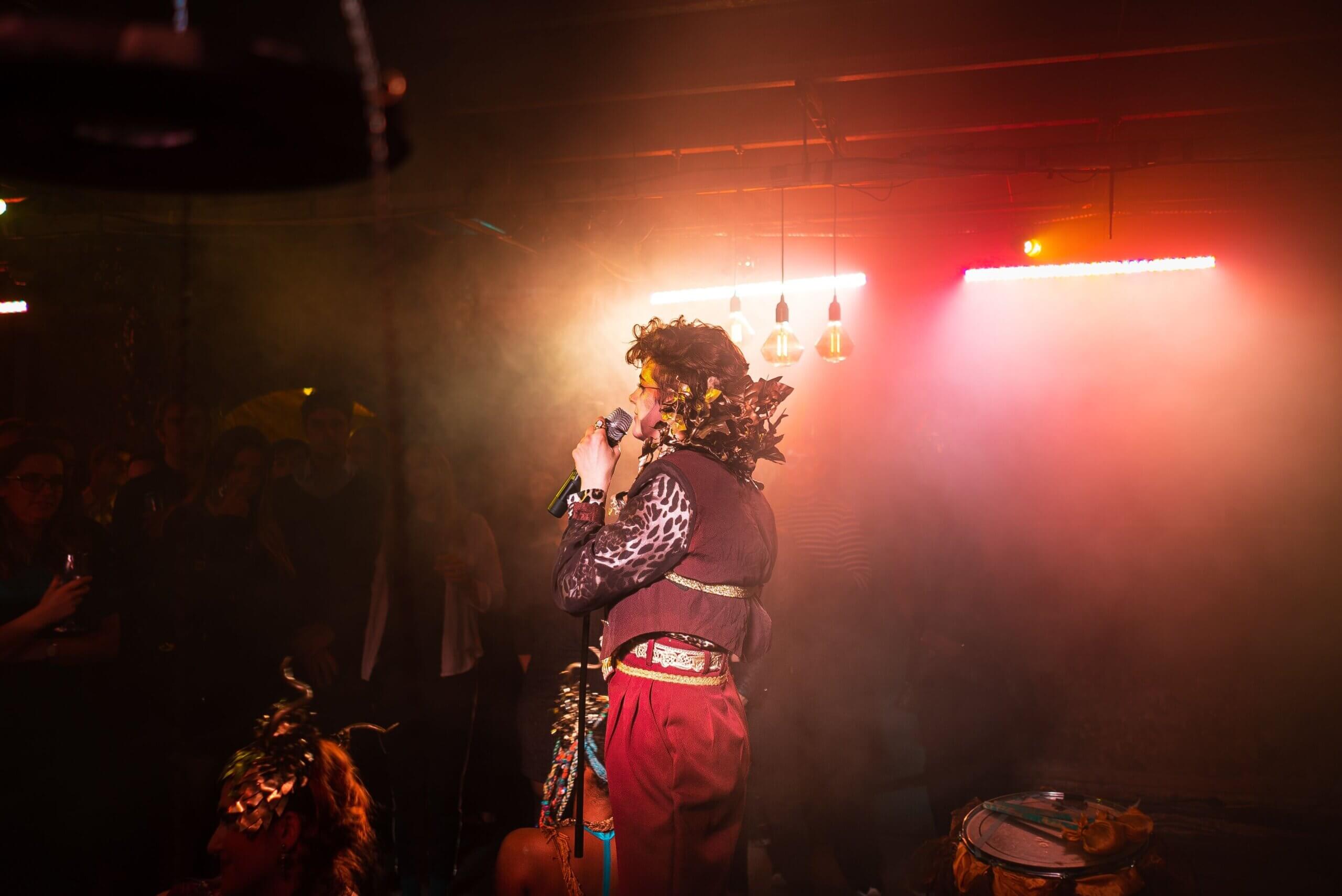 Actor singing in the Divine Proportions show at The Vaults, Waterloo, London