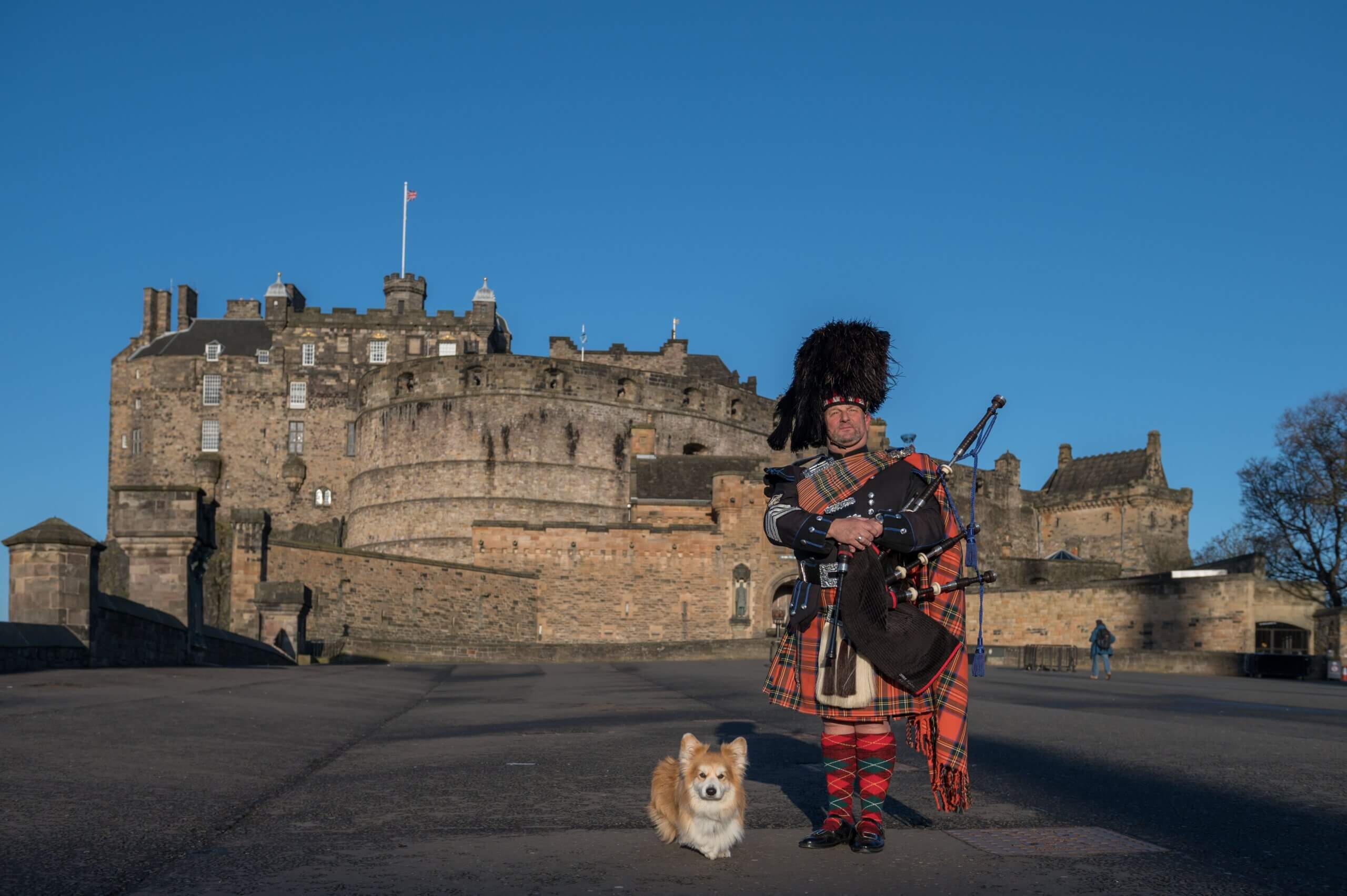 Dog called Marcel Le Corgi and a Piper at Edinburgh Castle, Scotland