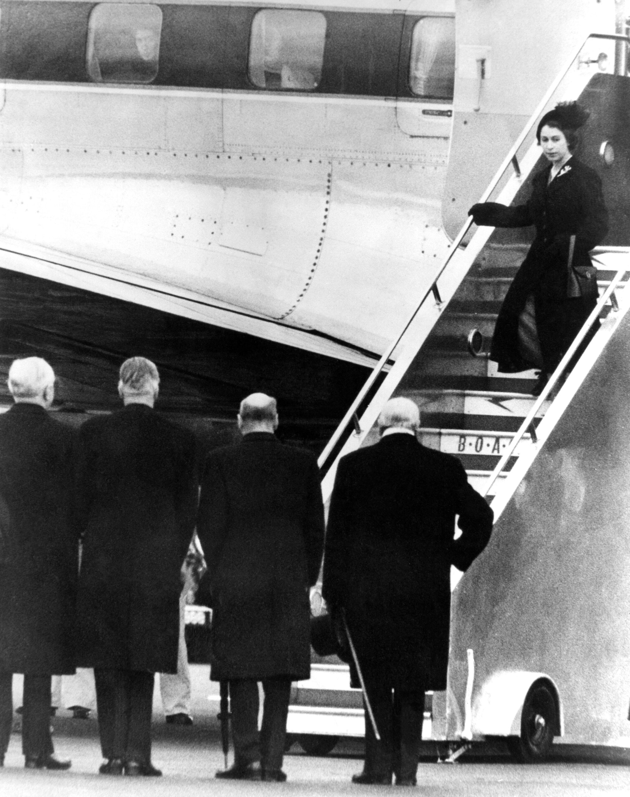 The New Queen Comes Home, 7th February 1952. Princess Elizabeth who left England last week with the Duke of Edinburgh for their Commonwealth Tour, returned to England today as Queen Elizabeth the Second. The royal couple cut short their tour and returned from Kenya to London Airport because of the King's death. Photo Shows: Waiting to greet the new Queen at London Airport this afternoon, were, right to left, Mr Winston Churchill ( Premier ), Mr Clement Attlee ( Leader of the Opposition ), Mr Anthony Eden ( Foreign Minister ) and Lord Woolton ( Lord President of the Council ). // These 25 pictures showcase some of Heathrow's most iconic moments as it celebrates its 80th birthday. Officially opened as London Airport in 1946 following two years of construction, its first flight in the newly post-war era was a converted Lancaster bomber called Starlight that flew to Buenos Aires. In its first year, 63,000 passengers had taken to the skies, compared to the 67 million who now jet off annually. The busiest airport in Europe, renamed Heathrow in September 1966, has seen many iconic moments in its 80 years of operation, from The Beatles return home from a US tour to England Rugby bringing home the World Cup.This photo licensed for one time use only in connection with SWNS story on the 80th anniversary of Heathrow Airport, no re-use, no archive.