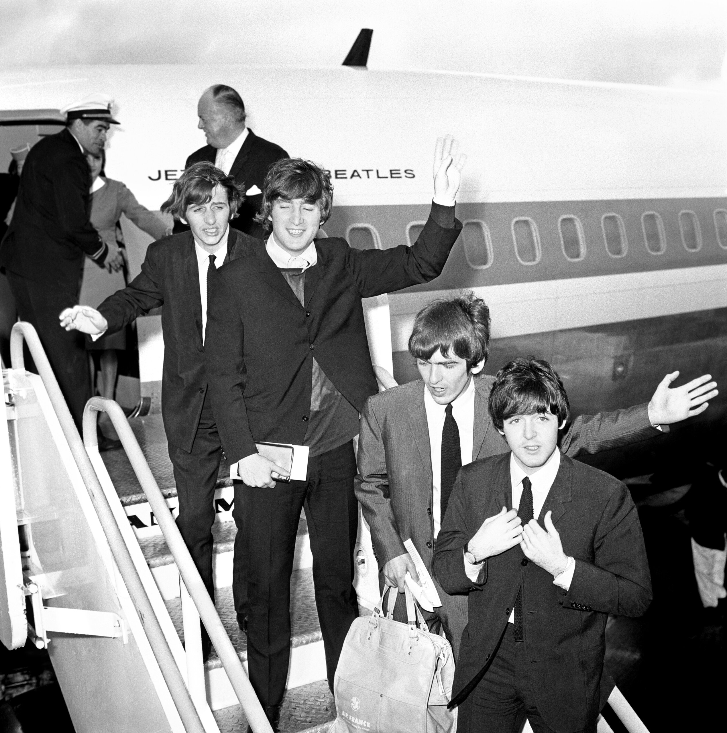 Ringo Starr, John Lennon, George Harrison and Paul McCartney board their plane at Heathrow airport for their tour of America in 1964. // These 25 pictures showcase some of Heathrow's most iconic moments as it celebrates its 80th birthday. Officially opened as ‘London Airport’ in 1946 following two years of construction, its first flight in the newly post-war era was a converted Lancaster bomber called Starlight that flew to Buenos Aires. In its first year, 63,000 passengers had taken to the skies, compared to the 67 million who now jet off annually. The busiest airport in Europe, renamed Heathrow in September 1966, has seen many iconic moments in its 80 years of operation, from The Beatles’ return home from a US tour to England Rugby bringing home the World Cup. This photo licensed for one time use only in connection with SWNS story on the 80th anniversary of Heathrow Airport, no re-use, no archive.