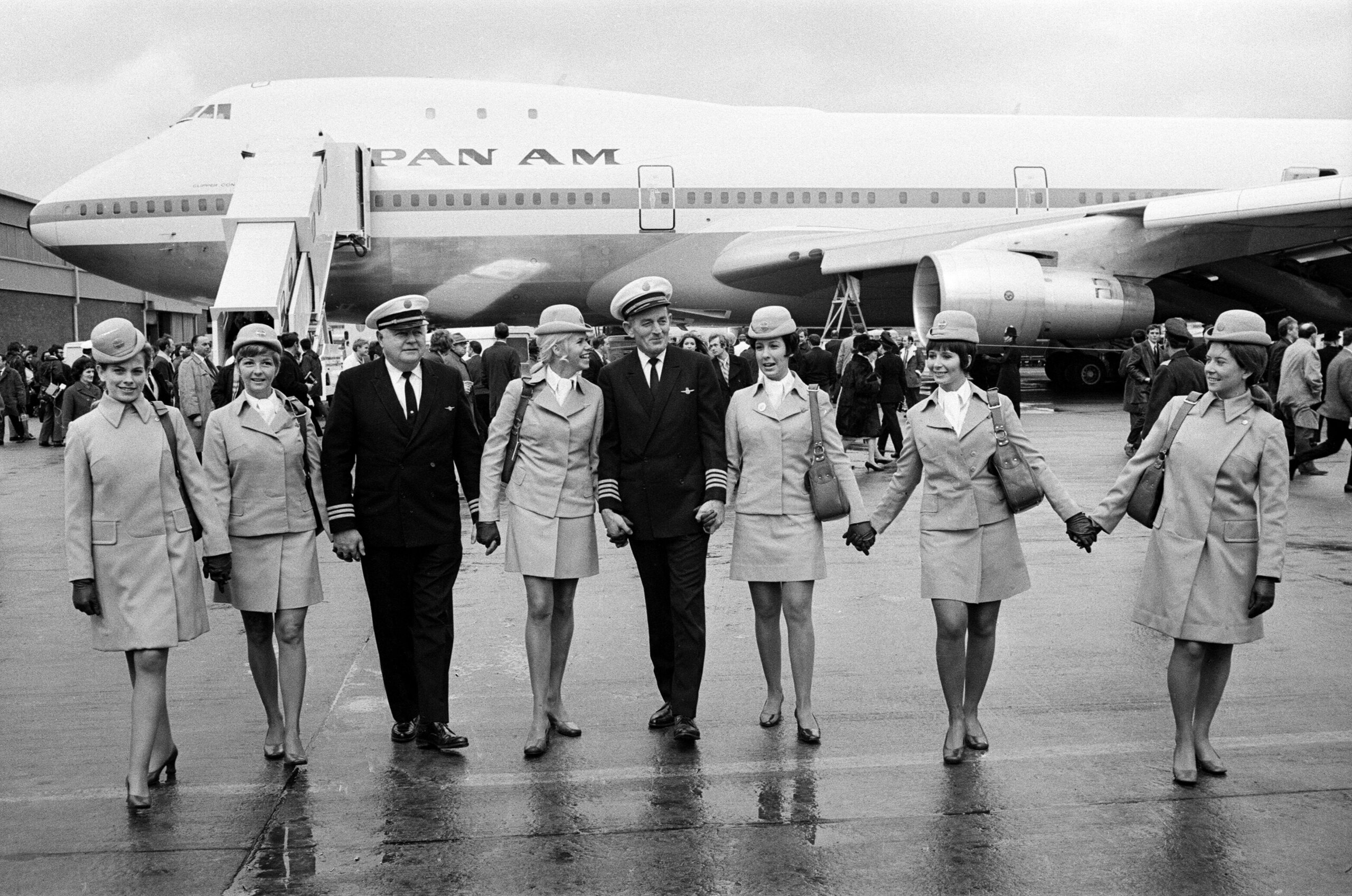 The 361 passenger Boeing 747 arrives at Heathrow Airport. The first Boeing 747 Jumbo jet to fly to Britain has arrived safely from New York. Jumbo jet has a cruising speed of 625 mph and should cut the New York to London journey by 30 minutes. Pictured, the Captain leads some of his crew away from the Jumbo after the landing. 12th January 1970. // These 25 pictures showcase some of Heathrow's most iconic moments as it celebrates its 80th birthday. Officially opened as ‘London Airport’ in 1946 following two years of construction, its first flight in the newly post-war era was a converted Lancaster bomber called Starlight that flew to Buenos Aires. In its first year, 63,000 passengers had taken to the skies, compared to the 67 million who now jet off annually. The busiest airport in Europe, renamed Heathrow in September 1966, has seen many iconic moments in its 80 years of operation, from The Beatles’ return home from a US tour to England Rugby bringing home the World Cup.This photo licensed for one time use only in connection with SWNS story on the 80th anniversary of Heathrow Airport, no re-use, no archive.
