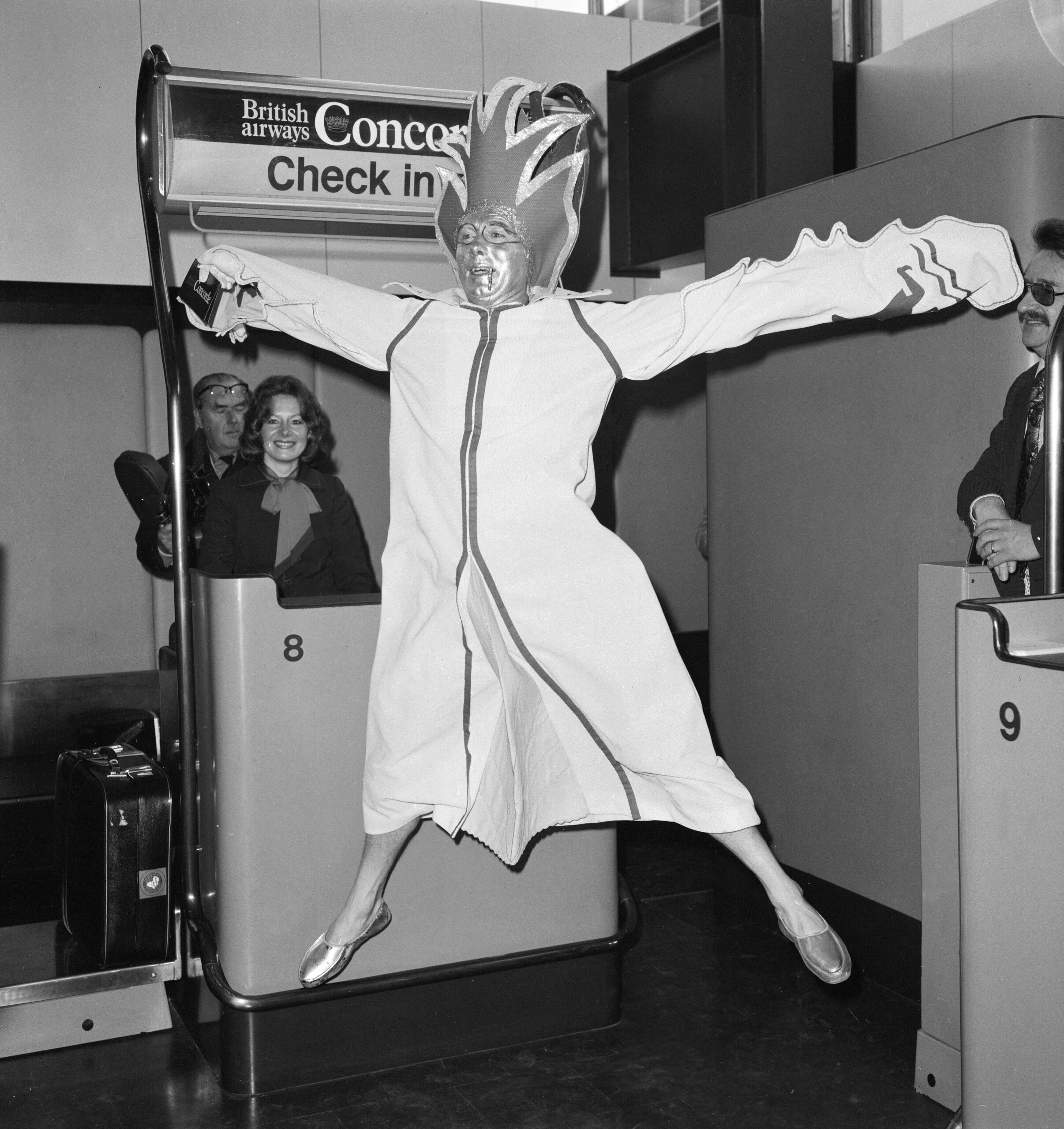 The launch of commercial flights of the supersonic airliner Concorde on 21st January 1976, seven years after its maiden test flight. Picture shows: Passenger Bob Ingham, who saved for three years for his plane ticket, pictured at Heathrow in the outfit he designed to do justice to the aircraft he worships. // These 25 pictures showcase some of Heathrow's most iconic moments as it celebrates its 80th birthday. Officially opened as London Airport in 1946 following two years of construction, its first flight in the newly post-war era was a converted Lancaster bomber called Starlight that flew to Buenos Aires. In its first year, 63,000 passengers had taken to the skies, compared to the 67 million who now jet off annually. The busiest airport in Europe, renamed Heathrow in September 1966, has seen many iconic moments in its 80 years of operation, from The Beatles return home from a US tour to England Rugby bringing home the World Cup. This photo licensed for one time use only in connection with SWNS story on the 80th anniversary of Heathrow Airport, no re-use, no archive.