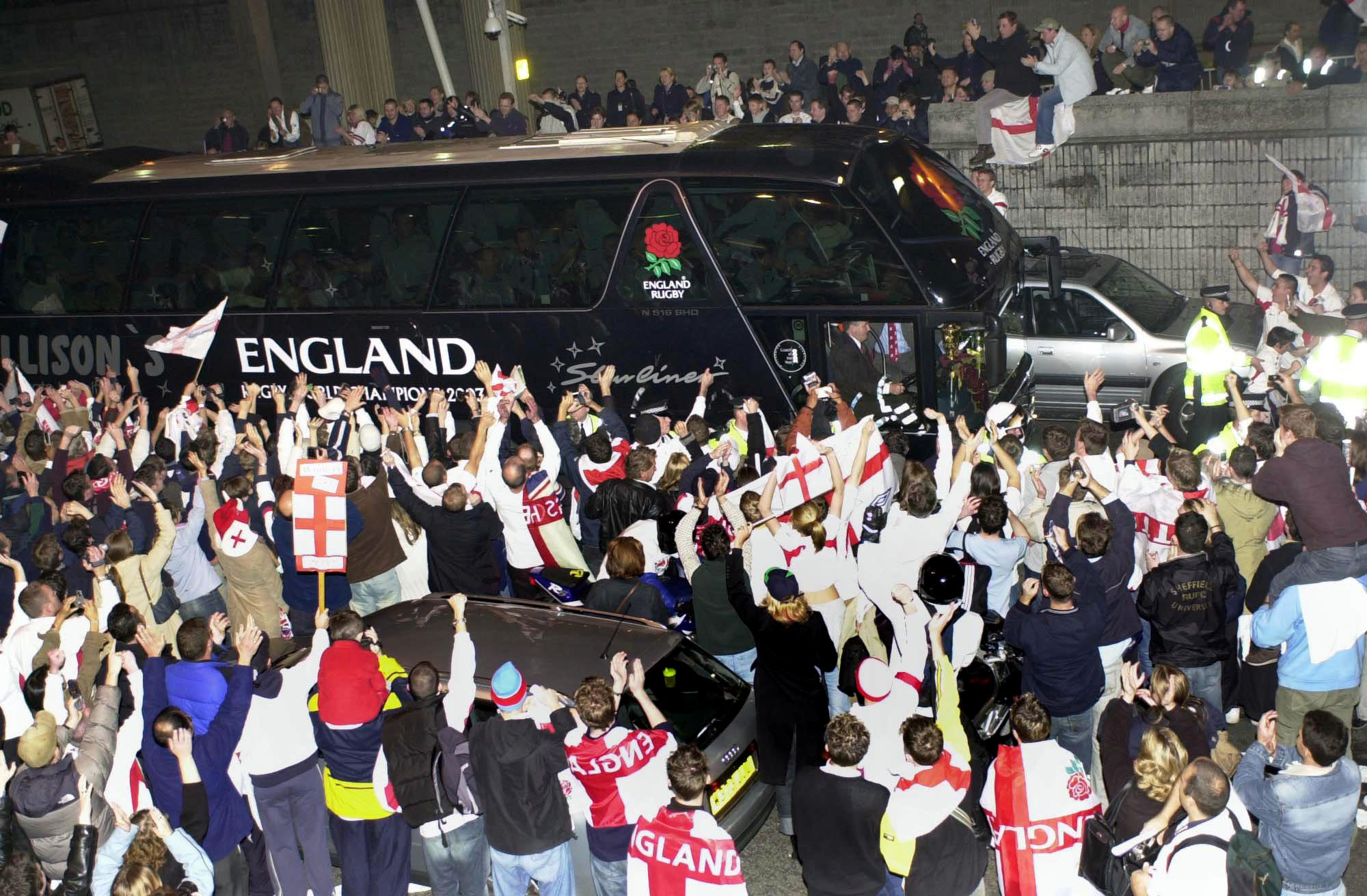 Fans surround the coach carrying the England rugby team at London's Heathrow Airport, after they arrived on a plane from Sydney. Thousands turned out to welcome home the players who won the World Cup after beating Australia Saturday in extra time. // These 25 pictures showcase some of Heathrow's most iconic moments as it celebrates its 80th birthday. Officially opened as London Airport in 1946 following two years of construction, its first flight in the newly post-war era was a converted Lancaster bomber called Starlight that flew to Buenos Aires. In its first year, 63,000 passengers had taken to the skies, compared to the 67 million who now jet off annually. The busiest airport in Europe, renamed Heathrow in September 1966, has seen many iconic moments in its 80 years of operation, from The Beatles return home from a US tour to England Rugby bringing home the World Cup. This photo licensed for one time use only in connection with SWNS story on the 80th anniversary of Heathrow Airport, no re-use, no archive.