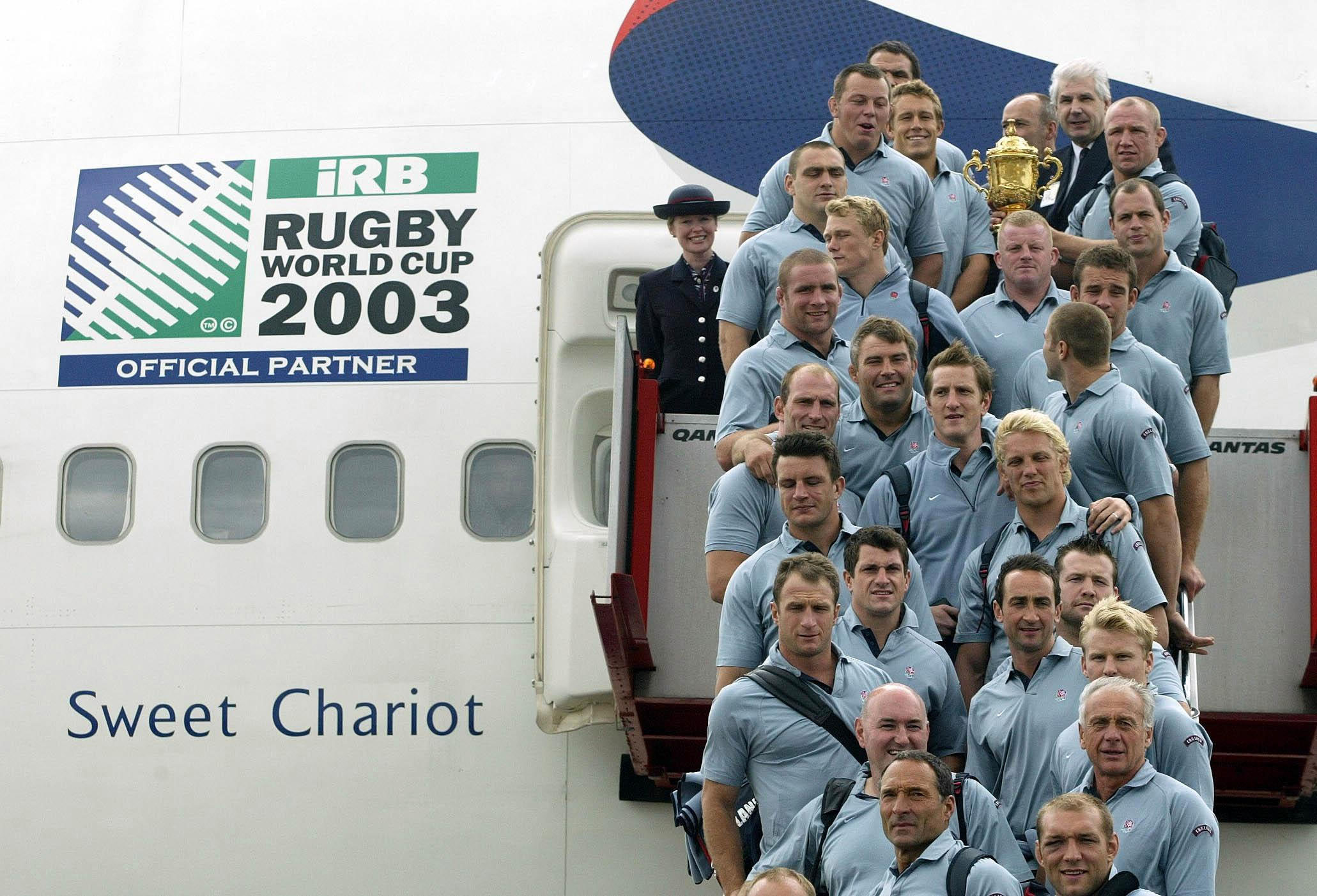 The England rugby squad pose for a photograph with the World Cup at Sydney Airport , as they board the plane - renamed Sweet Chariot - that is bringing them back to London. They are due to arrive at Heathrow in the early hours of Tuesday. // These 25 pictures showcase some of Heathrow's most iconic moments as it celebrates its 80th birthday. Officially opened as London Airport in 1946 following two years of construction, its first flight in the newly post-war era was a converted Lancaster bomber called Starlight that flew to Buenos Aires. In its first year, 63,000 passengers had taken to the skies, compared to the 67 million who now jet off annually. The busiest airport in Europe, renamed Heathrow in September 1966, has seen many iconic moments in its 80 years of operation, from The Beatles return home from a US tour to England Rugby bringing home the World Cup. This photo licensed for one time use only in connection with SWNS story on the 80th anniversary of Heathrow Airport, no re-use, no archive.