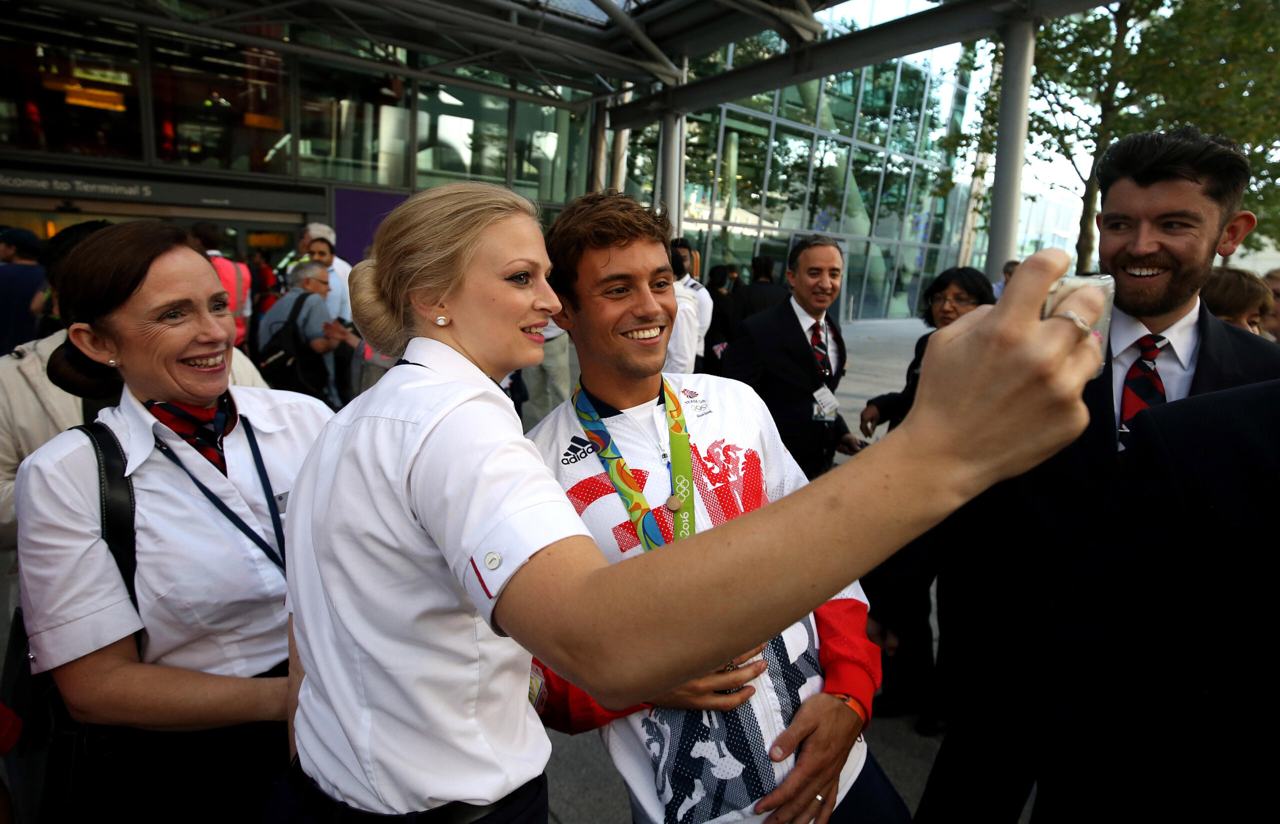 Great Britain's Tom Daley poses for pictures at Heathrow Terminal 5after arriving home from the Olympics in Rio de Janeiro. // These 25 pictures showcase some of Heathrow's most iconic moments as it celebrates its 80th birthday. Officially opened as London Airport in 1946 following two years of construction, its first flight in the newly post-war era was a converted Lancaster bomber called Starlight that flew to Buenos Aires. In its first year, 63,000 passengers had taken to the skies, compared to the 67 million who now jet off annually. The busiest airport in Europe, renamed Heathrow in September 1966, has seen many iconic moments in its 80 years of operation, from The Beatles return home from a US tour to England Rugby bringing home the World Cup. This photo licensed for one time use only in connection with SWNS story on the 80th anniversary of Heathrow Airport, no re-use, no archive.