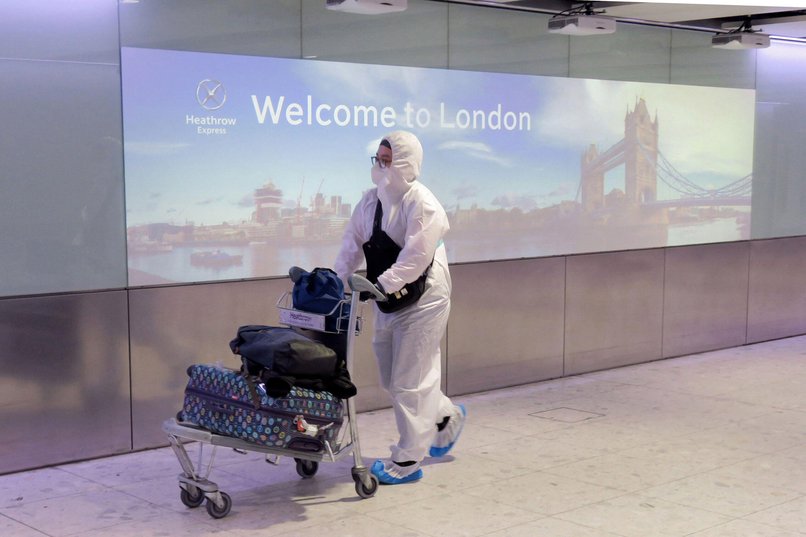 London, Britain. 1st May, 2020. A passenger wearing protective gear is seen at Heathrow Airport in London, Britain, on May 1, 2020. British Health Secretary Matt Hancock said Friday that the country has met the goal of 100,000 tests per day as another 739 people with COVID-19 have died, bringing the total coronavirus-related death toll to 27,510 in Britain. // These 25 pictures showcase some of Heathrow's most iconic moments as it celebrates its 80th birthday. Officially opened as London Airport in 1946 following two years of construction, its first flight in the newly post-war era was a converted Lancaster bomber called Starlight that flew to Buenos Aires. In its first year, 63,000 passengers had taken to the skies, compared to the 67 million who now jet off annually. The busiest airport in Europe, renamed Heathrow in September 1966, has seen many iconic moments in its 80 years of operation, from The Beatles return home from a US tour to England Rugby bringing home the World Cup.